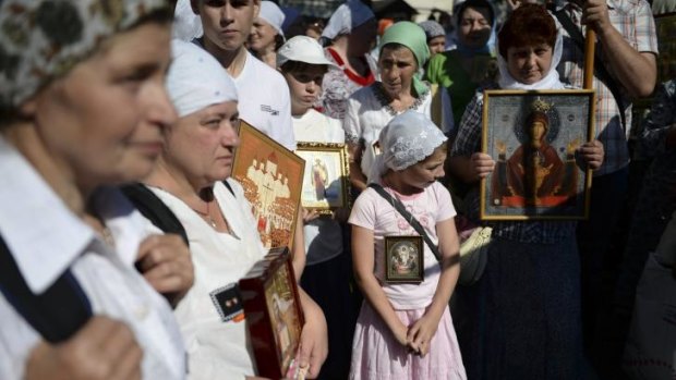 Pilgrims gather before the start of their trek to the monastery of St Sergius in Khotkovo, Russia, on July 16.