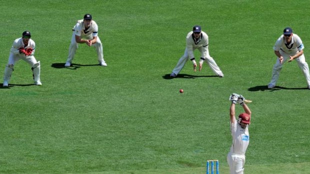 Victorians (from left) Matthew Wade, Cameron White, David Hussey and Andrew McDonald field  as Queensland's Wade Townsend lets one pass.