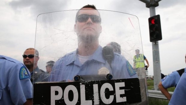 Police block demonstrators from gaining access to Interstate Highway 70.