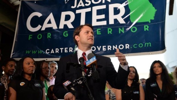 Jason Carter speaks with supporters.