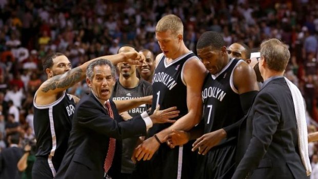 Nets centre Mason Plumlee is congratulated after his match-winning play against Miami.