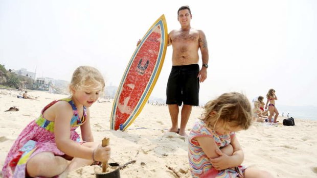 Praising the tight-knit community: Cooper Silk, who favours Bondi, with his children, Casey, 5 and Skylar, 3.