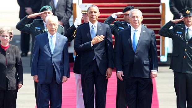 The big thaw ... Mr Obama is greeted at the airport by Mr Netanyahu and the Israeli President, Shimon Peres.