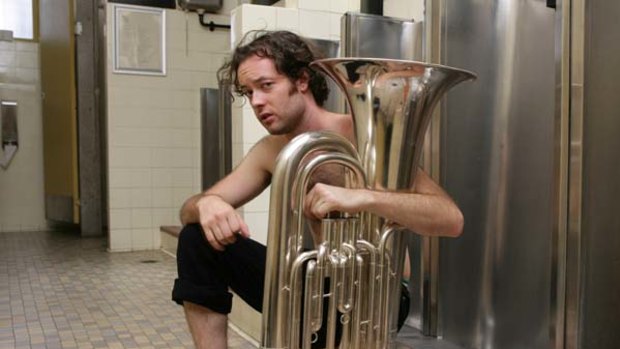 Gareth Davies stars in the Belvoir Street Theatre production of The Suicide. . Tuba supplied by Sax and Woodwind/Camperdown.