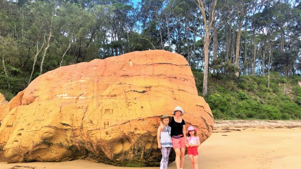 The Yowie girls visit the big boulder on Quiriga Beach.