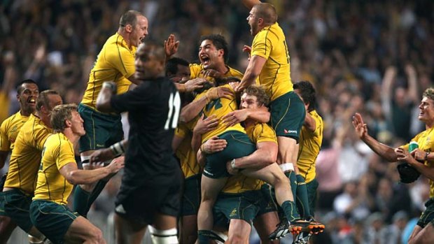 Celebration ... the Wallabies celebrating last May's famous victory over New Zealand in Hong Kong.