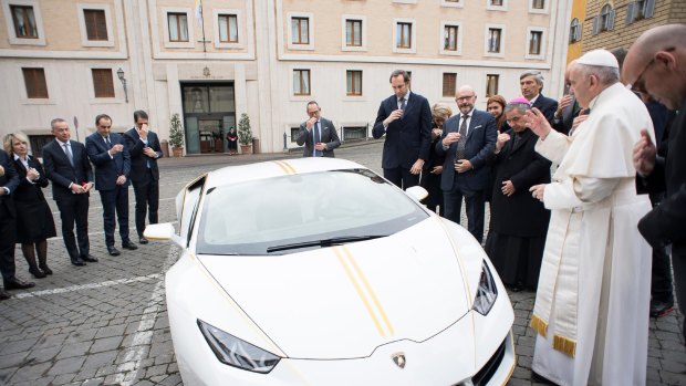 Pope Francis blesses the Lamborghini.