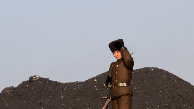 A solider patrols a Port in Sinuiju, North Korea. Photo by Sanghee Liu