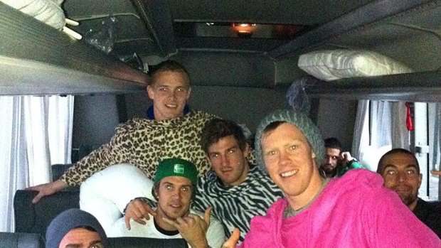 Jack Riewoldt and his Tigers teammates don Snuggies for the long bus trip home.