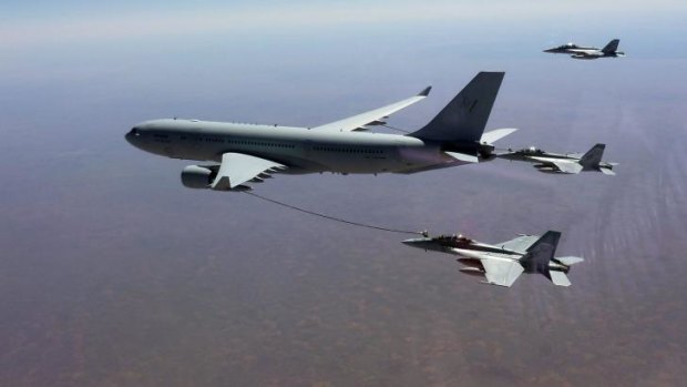 Petrol station in the sky ... A Royal Australian Air Force KC-30A Multi Role Tanker Transport aircraft refuels an F/A-18F Super Hornet as two others wait their turn.