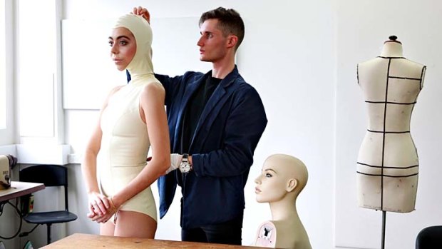 Controversial: Fashion student Bronson Jack fits model Mollie Miles with a latex/rubber leotard.