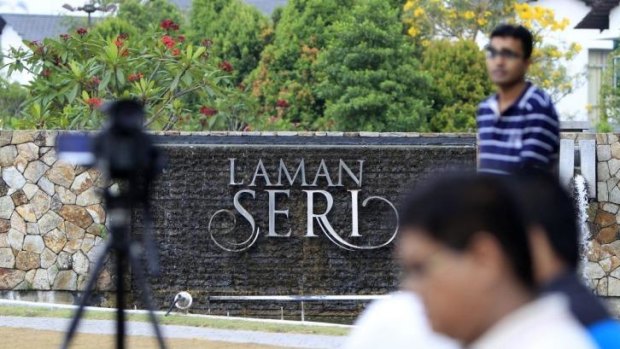 Journalists wait outside the missing Malaysia Airlines pilot Zaharie Ahmad Shah's house near Kuala Lumpur.