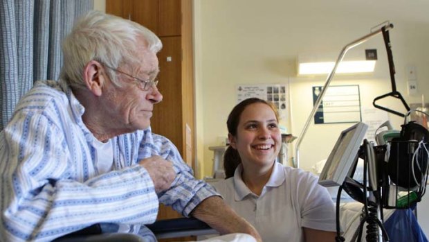 Entry point ... student Kristy Sciberras tends to patient David Wilson in the acute age care unit at RPA Hospital.