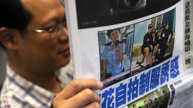 Photos splashed across the newspapers ... Hong Kong police have launched an internal inquiry.