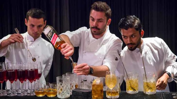 How the pros do it:cocktail bartenders (from left) Andy Watson, Luke Ashton and Phoenix Naman Dave at the Johnnie Walker Red mix project function.