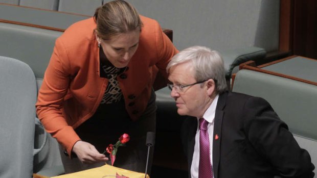 Kelly O'Dwyer Liberal backbencher gives a chocolate rose to Kevin Rudd.