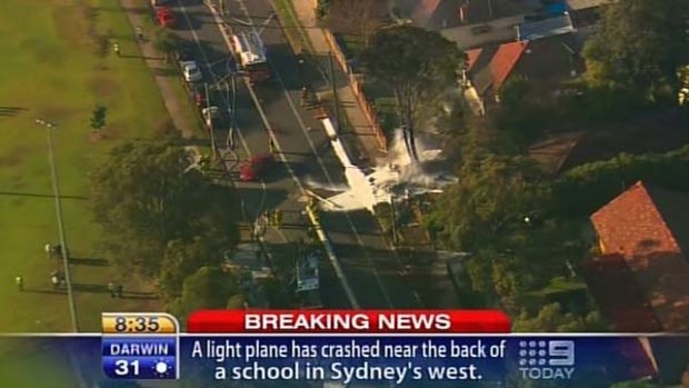 Two dead ... a plane crashed into a street in Sydney's south west.