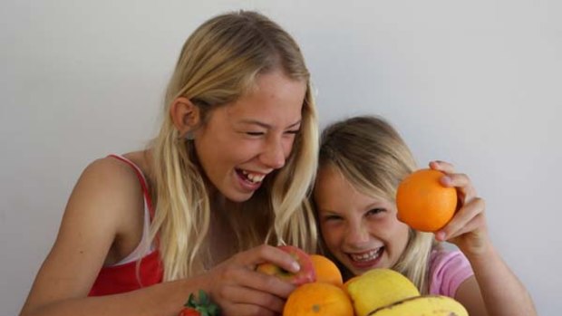 Fresh is best ... Ella and Phoebe Saberton are encouraged to eat unprocessed foods.