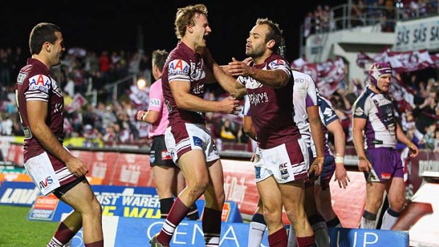 Daly Cherry-Evans and Brett Stewart celebrate the fullback's first-half try.