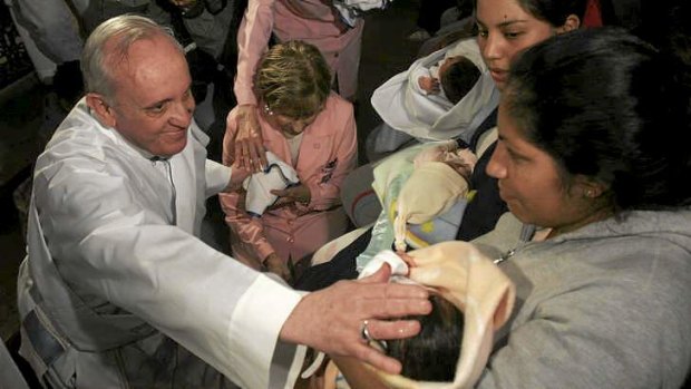 Argentina's Cardinal Bergoglio, blessing a baby after a Mass in Buenos Aires earlier this month.