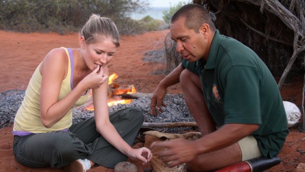 Guide Darren 'Capes' Capewell treats a tourist to traditional fare.