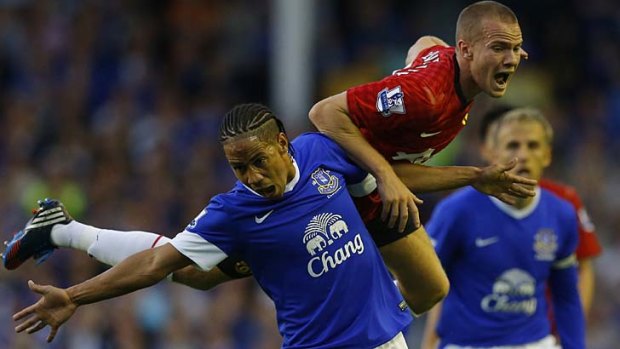 Tough contest: Everton's Steven Pienaar and Manchester United's Tom Cleverley.
