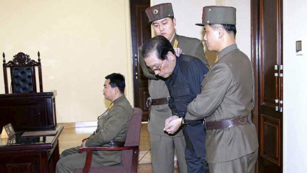 Jang Song Thaek, with his hands tied with a rope, is dragged into court by uniformed personnel. North Korea said that Jang, the uncle of leader Kim Jong Un, has been executed for treason, the biggest upheaval since the death of Kim's father two years ago.