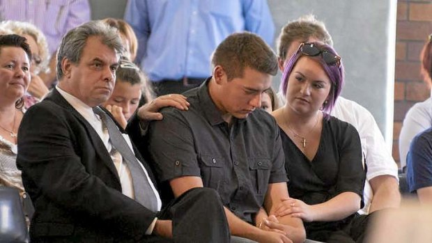 John Cremin (second from right), Yvanna's half brother, sits with family at the memorial service in Caloundra.