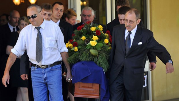 Sons Barry (left) and Ian carry the coffin of their father, William Ellis Green.