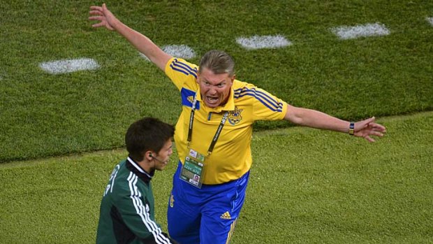 Livid ... Ukraine coach Oleg Blokhin lashes out at a match official after the goal was disallowed.