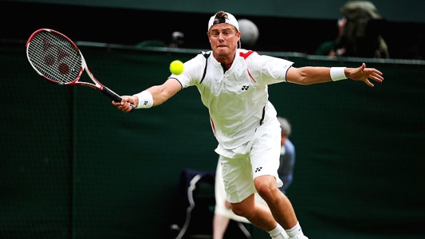 Lleyton Hewitt reaches for a shot during his five-set battle with Robin Soderling.