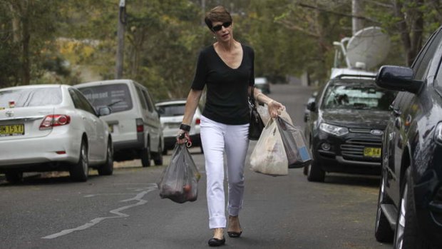 In the bag: Margie Abbott walks to her Forestville home.