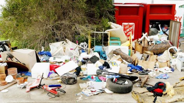 Useless donations: charity bins have become dumping sites as landfill costs rise.