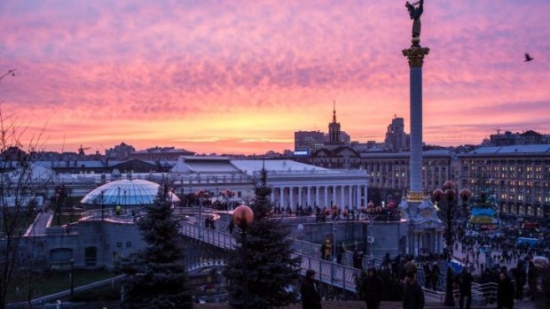 The sun sets over Independence Square in Kiev, Ukraine.