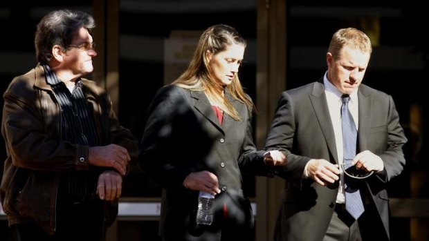 Charged: Police Constable Megan McNamara, centre, leaves Newcastle Local court on Tuesday.