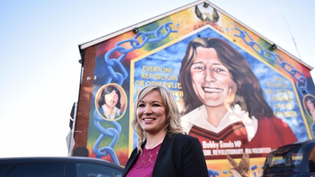 Sinn Fein leader Michelle O'Neill stands in front a mural of republican hunger striker Bobby Sands after holding a post election press conference at Sinn Fein headquarters.