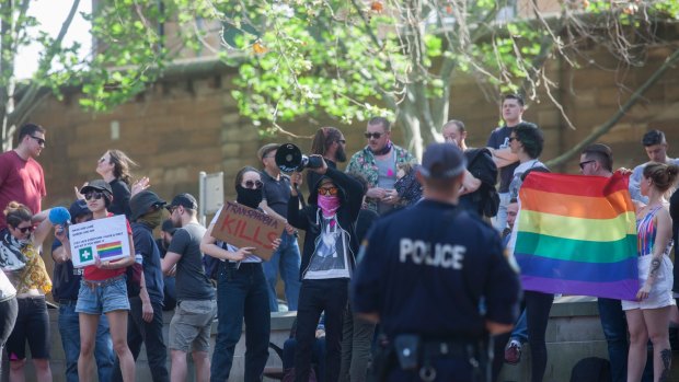 Protesters standing against the Party For Freedom's Straight Lives Matter rally in Green Park, Sydney.