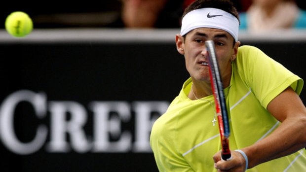 Tommy gun ... 17-year-old Australian hope Bernard Tomic was forced to wait for rain showers to blow over before returning to complete a straight-sets victory over France’s Guillaume Rufin in the first round of the Australian Open last night.