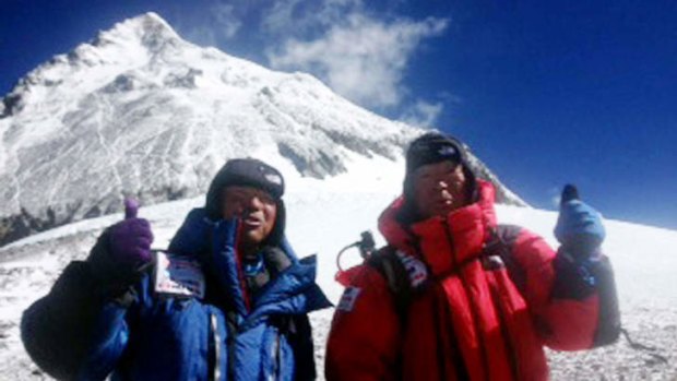 Yuichiro Miura (right) and his son Gota leave the C4 camp to ascent to the summit of Mount Everest.