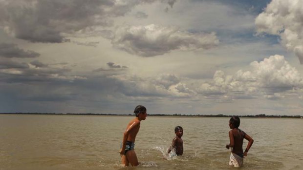 ''It's slowly coming back to life and we're counting on a good crop this year.'' &#8230; Lake Cargelligo now provides welcome relief from the heat, as these local boys prove. Photo: Jacky Ghossein