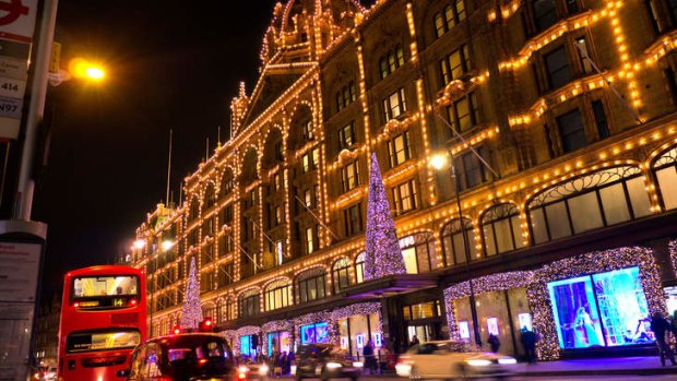 Harrods department store in London is lit up by Christmas lights.