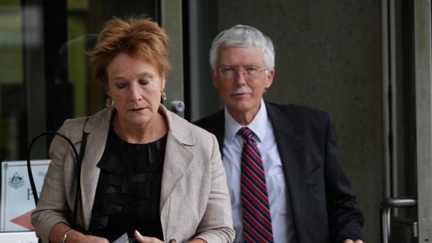 Former James Hardie director Meredith Hellicar and Michael Brown exit the High Court of Australia.