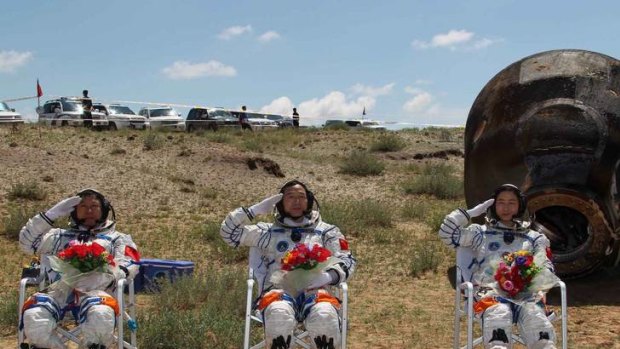 Space crew Liu Wang, Jing Haipeng and Liu Yang on terra firma.