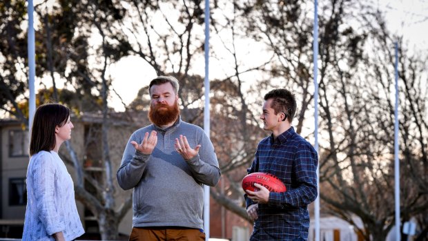Ramas McRae, (centre), Sam Cartledge (right) and Alex McDonald all want the AFL to introduce an Auslan interpreter for the Grand Final. 