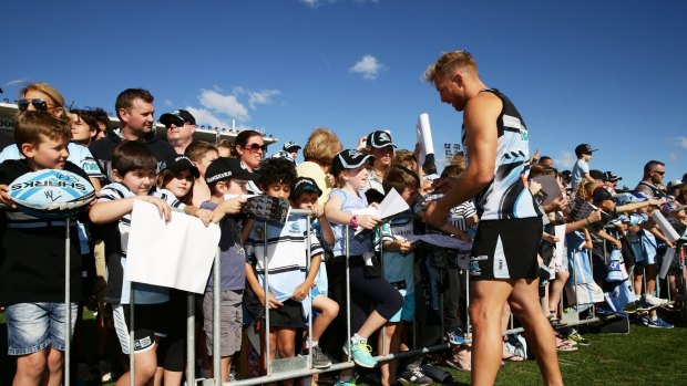 Sign of the times: Matt Prior signs autographs for fans at Southern Cross Group Stadium.