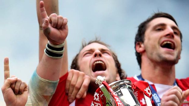 Wales captain Sam Warburton lifts the Six Nations trophy.
