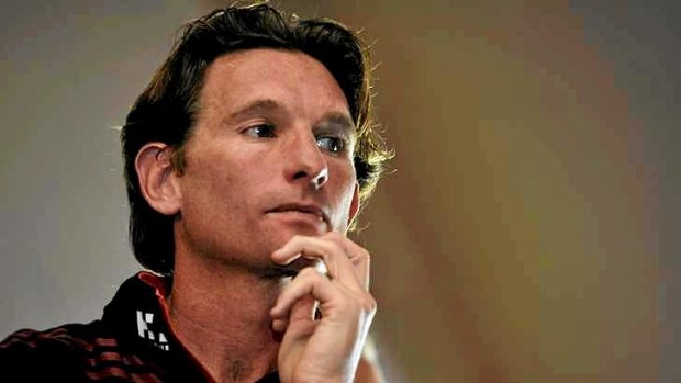 Spotlight: Essendon coach James Hird looks on as chairman Dave Evans discusses the findings of Dr Ziggy Switkowski's report on the club's management of the controversial strengthening program.