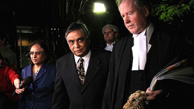 Jayant Patel, flanked by his wife Kishoree and his lawyers, returns to court to hear his fate.