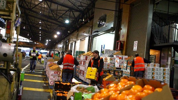 Workers at Melbourne's wholesale fruit and vegetable market.