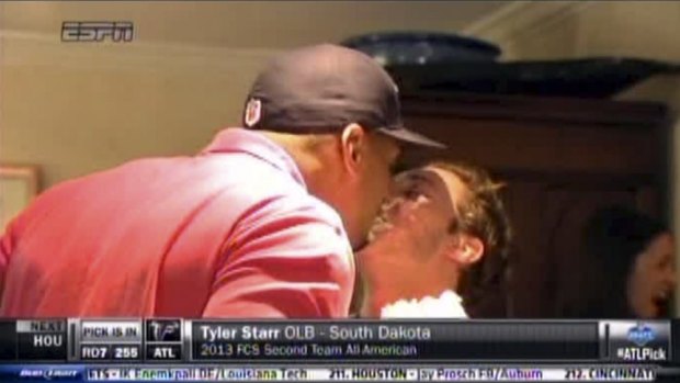 Michael Sam kisses his partner after being drafted by the St Louis Rams.